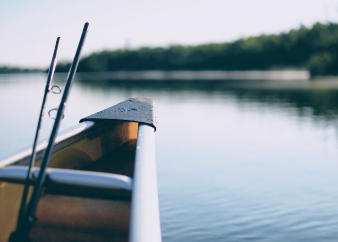 Tip of rowboat with fishing rods